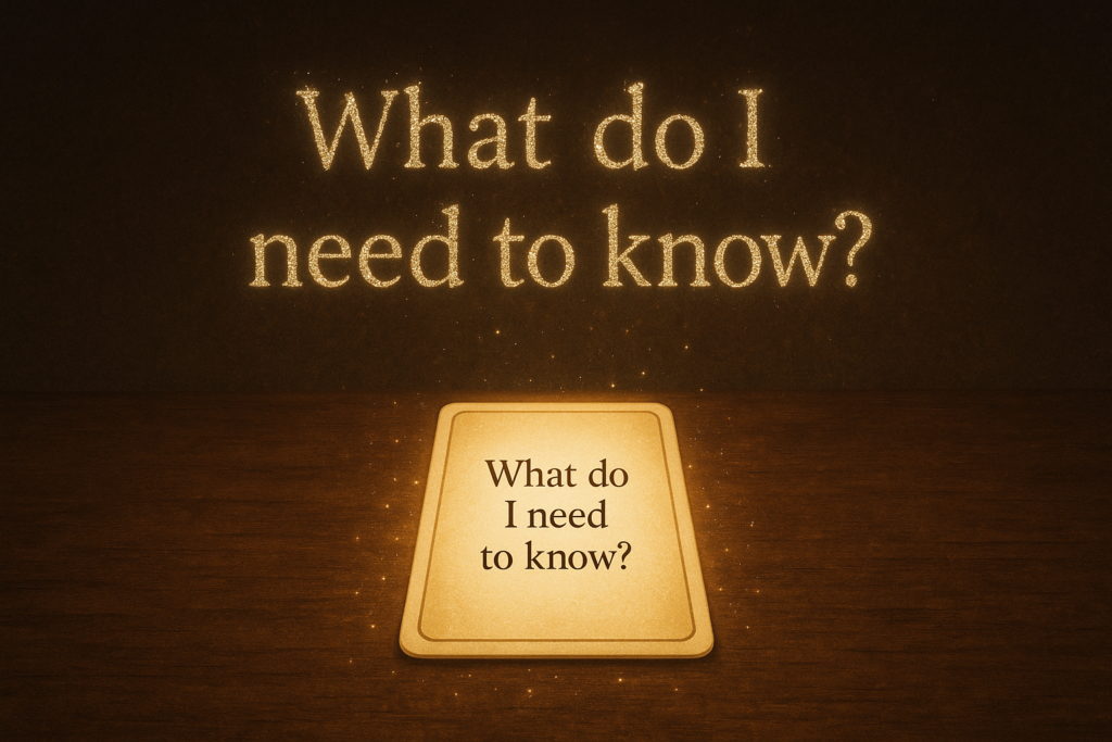 Glowing oracle card on a table with the guiding question ‘What do I need to know?’ above it.